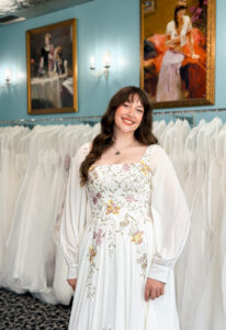 A wedding gown from Stella's Private Collection featuring exclusive bridal design elements such as intricate lace, elegant draping, luxurious fabrics, and timeless silhouettes. Each gown is uniquely curated and available exclusively at Love it at Stella's Bridal.