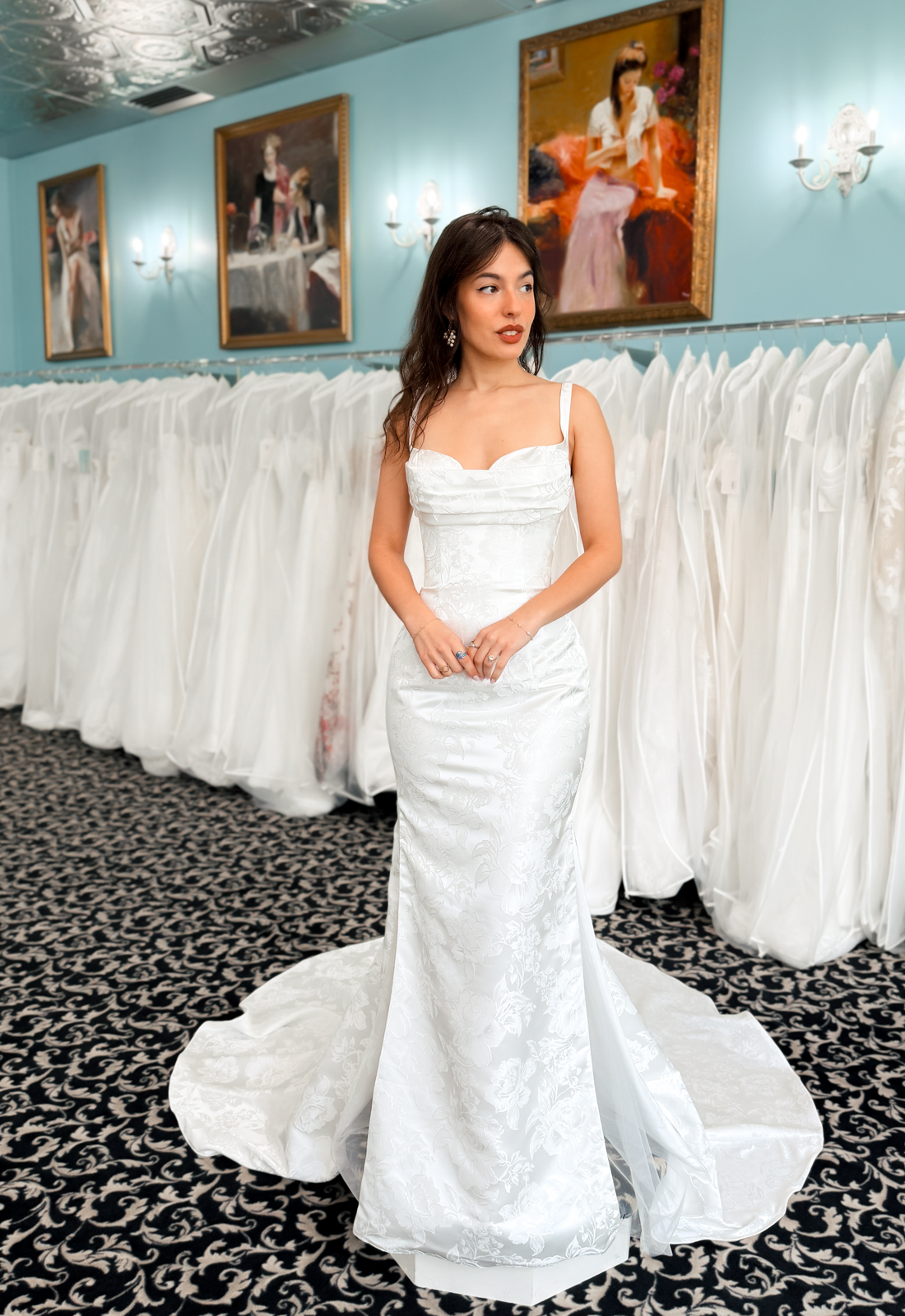 A wedding gown from Stella's Private Collection featuring exclusive bridal design elements such as intricate lace, elegant draping, luxurious fabrics, and timeless silhouettes. Each gown is uniquely curated and available exclusively at Love it at Stella's Bridal.