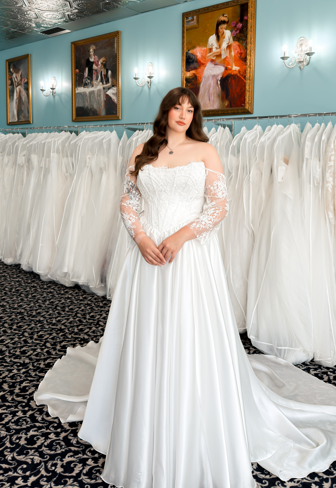 A wedding gown from Stella's Private Collection featuring exclusive bridal design elements such as intricate lace, elegant draping, luxurious fabrics, and timeless silhouettes. Each gown is uniquely curated and available exclusively at Love it at Stella's Bridal.