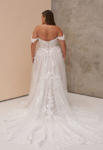 Osha - Stella's Bridal Madi Lane Osha wedding dress featuring an a-line silhouette with sweetheart neckline, boho lace skirt, and corseted details. Available at Stella’s Bridal in Westminster, Maryland.