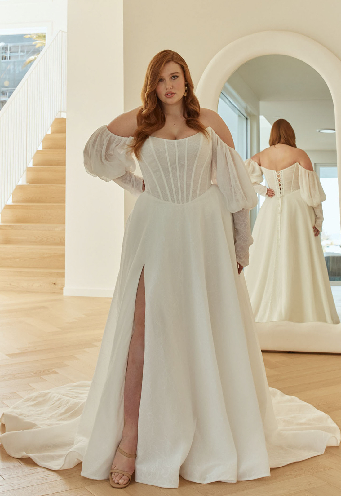 Sam - Stella's Bridal An a-line wedding dress in patterned chiffon, featuring a basque waistline and optional sleeves. Shown in Ivory and designed by Serene by Madi Lane Bridal. A modern bridal gown available at Stella’s Bridal in Westminster, Maryland. Serene by Madi Lane Bridal Style SR2616 Sam.