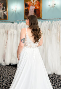 A wedding gown from Stella's Private Collection featuring exclusive bridal design elements such as intricate lace, elegant draping, luxurious fabrics, and timeless silhouettes. Each gown is uniquely curated and available exclusively at Love it at Stella's Bridal.