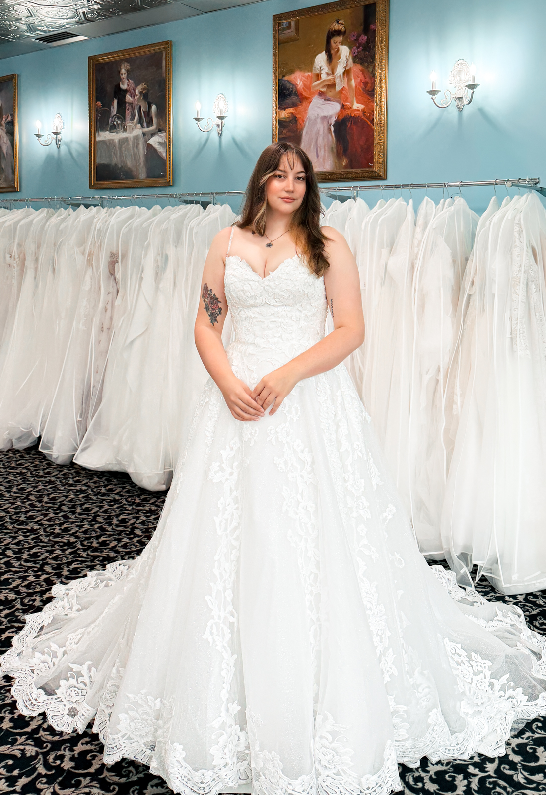 A wedding gown from Stella's Private Collection featuring exclusive bridal design elements such as intricate lace, elegant draping, luxurious fabrics, and timeless silhouettes. Each gown is uniquely curated and available exclusively at Love it at Stella's Bridal.