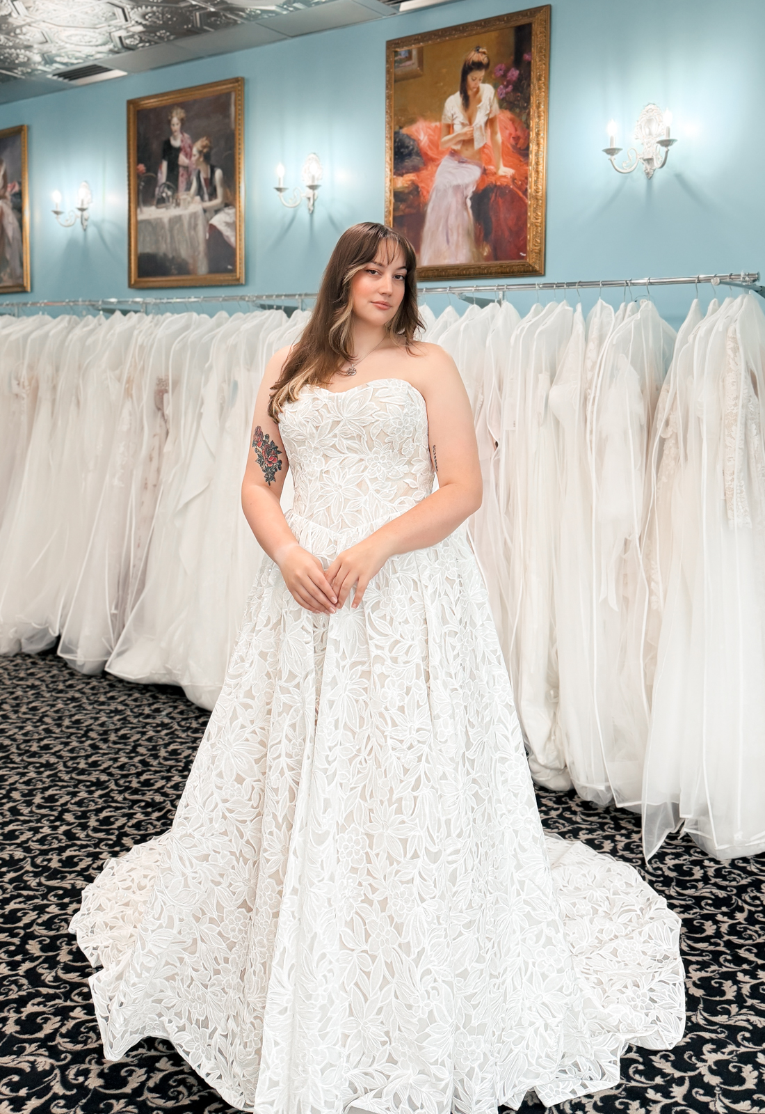 A wedding gown from Stella's Private Collection featuring exclusive bridal design elements such as intricate lace, elegant draping, luxurious fabrics, and timeless silhouettes. Each gown is uniquely curated and available exclusively at Love it at Stella's Bridal.