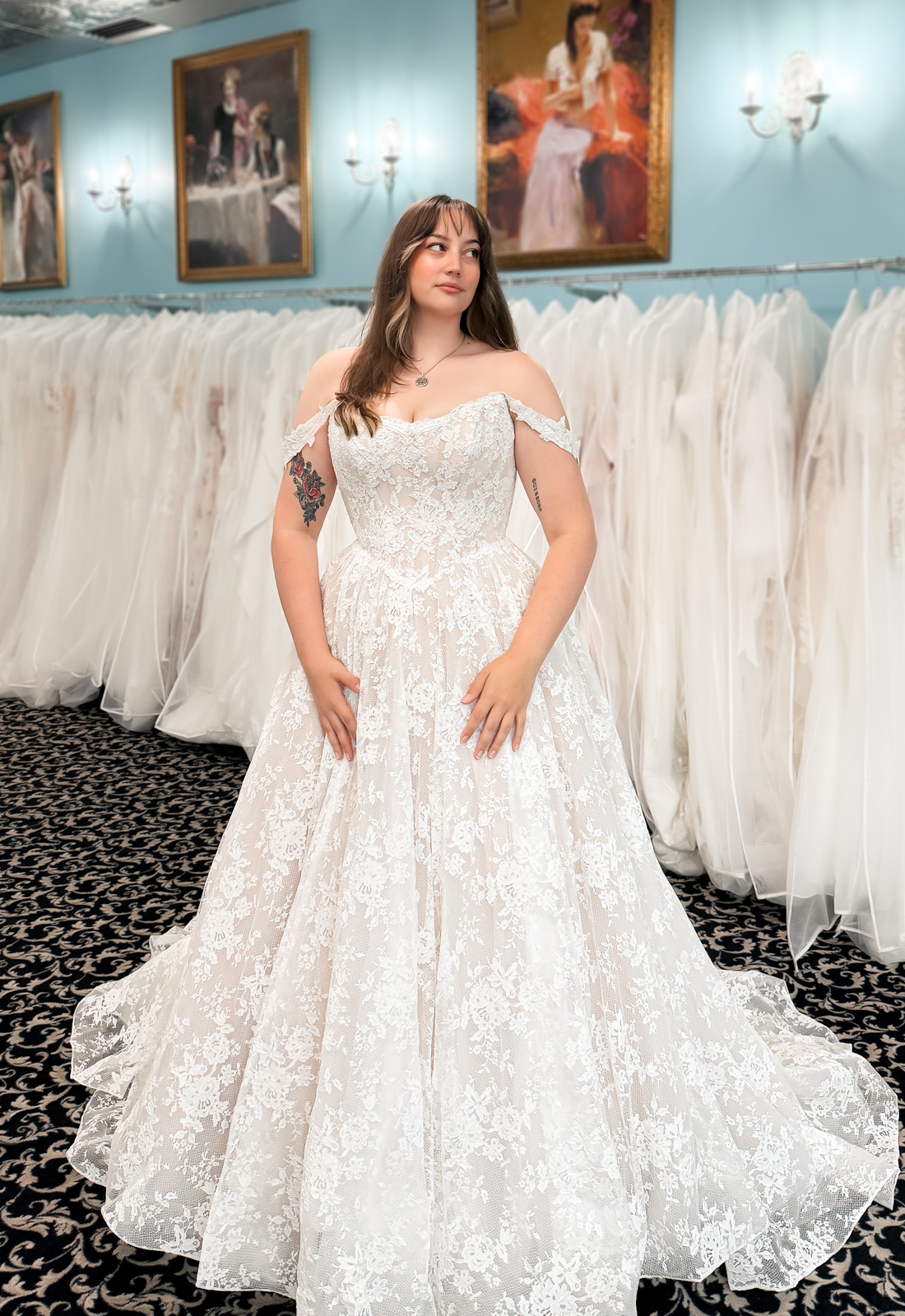 A wedding gown from Stella's Private Collection featuring exclusive bridal design elements such as intricate lace, elegant draping, luxurious fabrics, and timeless silhouettes. Each gown is uniquely curated and available exclusively at Love it at Stella's Bridal.