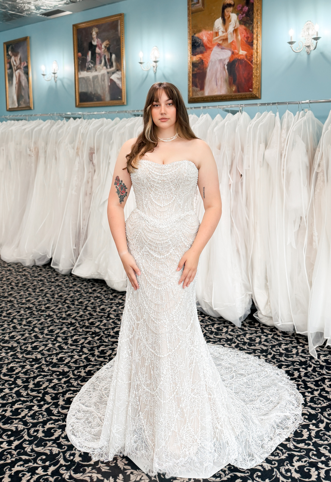A wedding gown from Stella's Private Collection featuring exclusive bridal design elements such as intricate lace, elegant draping, luxurious fabrics, and timeless silhouettes. Each gown is uniquely curated and available exclusively at Love it at Stella's Bridal.