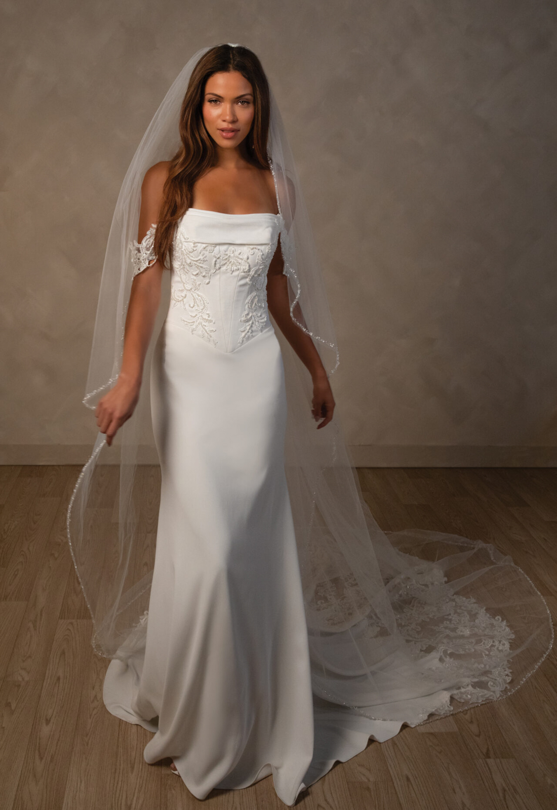 Essense of Australia D4590 Vivienne wedding dress featuring a deep basque waist, straight neckline, and pearl embellished fabric, shown from the front. Available at Love it at Stella's Bridal in Westminster, Maryland