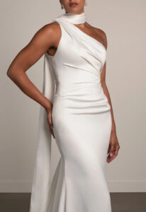 Essense of Australia PA1487 Andie wedding dress featuring a sleek silhouette, one shoulder neckline, and silky satin fabric, shown up close. Available at Love it at Stella's Bridal in Westminster, Maryland
