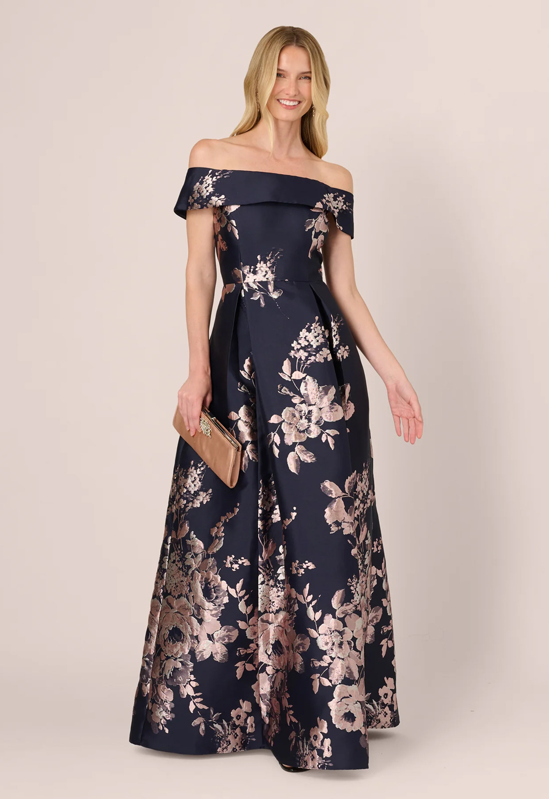Discover AP1E212662 by Adrianna Papell, a flowy mother of the bride or groom dress featuring metallic florals. Shop at Stella’s Bridal in Westminster, MD.