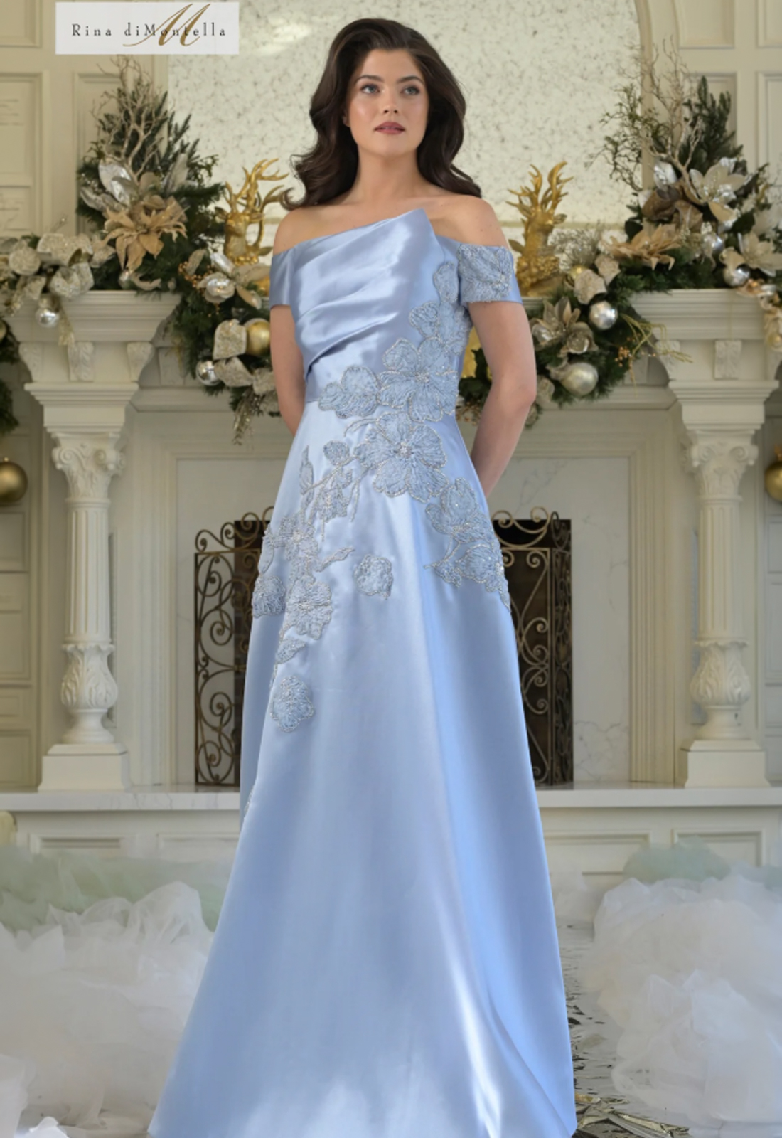 Discover RD3344 by Rinda di Montella, a flowy mother of the bride or groom dress featuring 3D Florals. Shop at Stella’s Bridal in Westminster, MD.