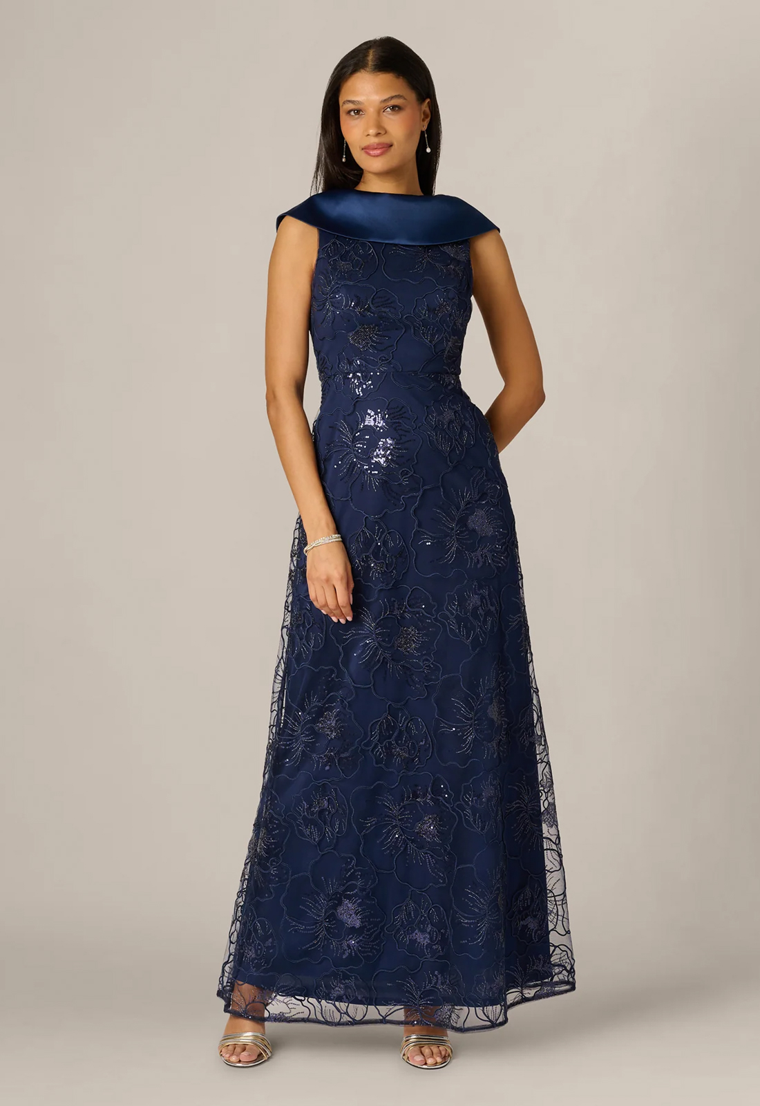 Discover AP1E213190 by Adrianna Papell, a flowy mother of the bride or groom dress featuring a high neckline. Shop at Stella’s Bridal in Westminster, MD.