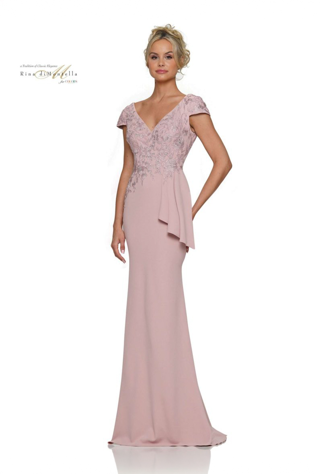 Discover RD2960 by Rina di Montella, a fitted mother of the bride or groom dress featuring cap sleeves. Shop at Stella’s Bridal in Westminster, MD.
